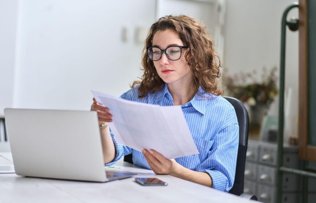 businesswoman looking at files in office