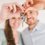 A couple holding house keys