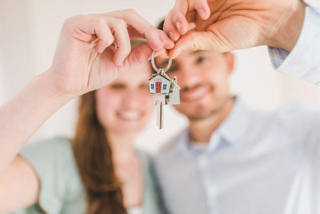 A couple holding house keys