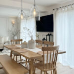 Custom sheer curtains with linen blends bring a airy vibe to the living room