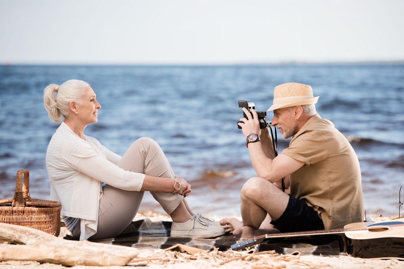 Senior couple enjoying a beach photo session in Sarasota, captured by a photographer in Sarasota FL
